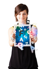 Young woman looking at modern tablet with alphabet