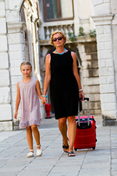 Touring Venice - woman and girl on the way to the hotel