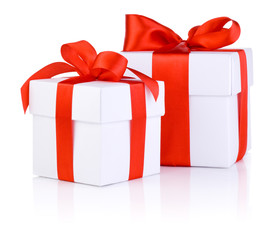 Two White boxs tied with a red satin ribbon bow Isolated on whit