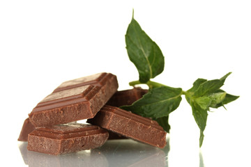 Pieces of chocolate and mint isolated on white