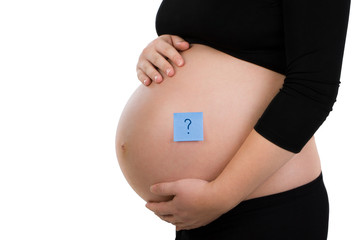 Pregnant woman holding her belly with blue sticker
