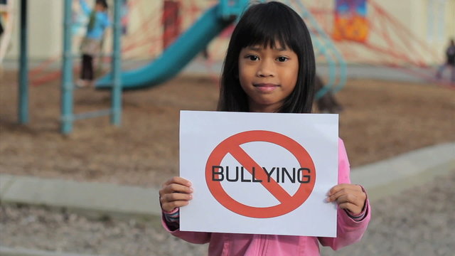 Cute Asian Girl With Large NO BULLYING sign