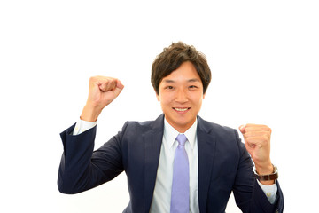 ガッツポーズをするビジネスマン
