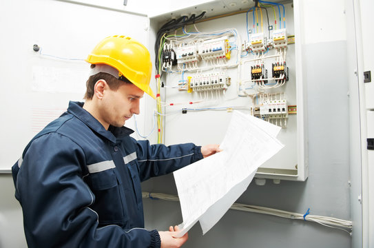 Electrician checking cabling power line