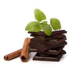 Chocolate bars stack and cinnamon sticks