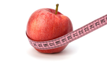 Apple with tape measure. Healthy lifestyle concept.