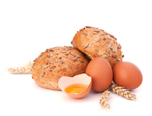 Bun with seeds and broken egg