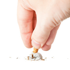 hand extinguishing a cigarette on white