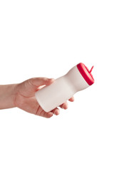 Hand with a plastic bottle isolated on white background