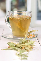 Glass cup of tea with linden