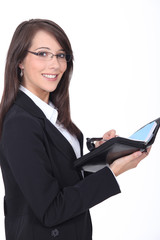 Young woman with a personal organizer