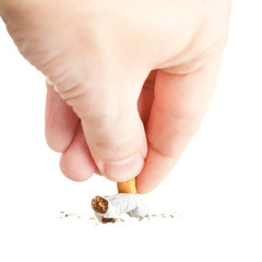 hand extinguishing a cigarette on white