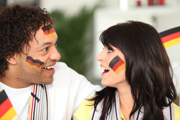 Naklejka premium German couple happy with teams performance