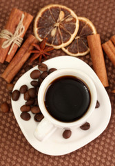 Cup of coffee on brown background