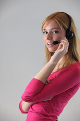 Woman wearing telephone head-set