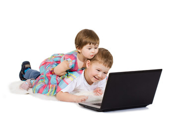 Children look cartoon films on the laptop