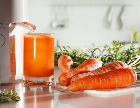 Fresh carrot juice and juicer