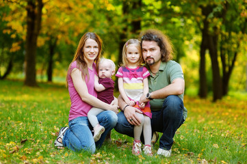 Fototapeta premium Family of four at autumn