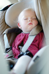 Infant baby sleeping in a car seat