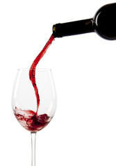 Pouring red wine in a glass