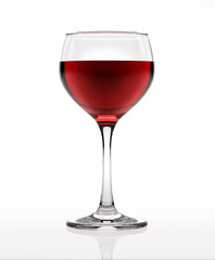 Red wine glass, on white surface and background, viewed from a s