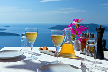 Table above sea for two. - obrazy, fototapety, plakaty