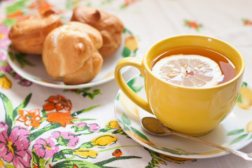 Tea with lemon  and cakes