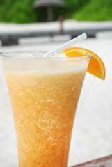 Orange coctail on sand beach, Maldives