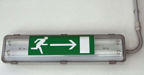 emergency exit sign installed within a European factory