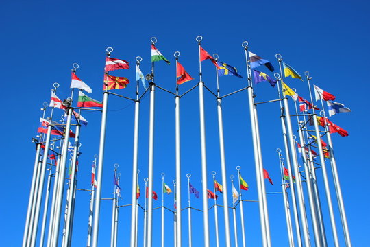 Flags of European countries against the blue sky