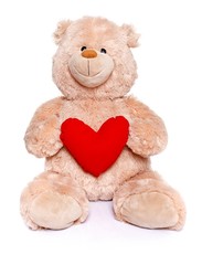 Teddy bear holding red heart