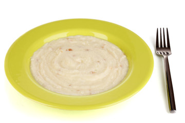 Mashed potatoes in green plate isolated on white