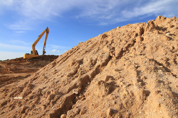 excavator loader machine during earthmoving works outdoors at co
