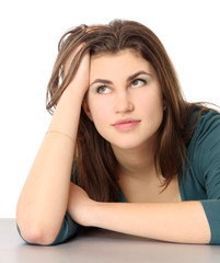 Fototapeta premium A young woman sitting isolated on white background