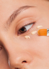 Woman applying foundation