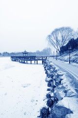 Chinese traditional style wooden bridge in the snow