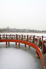 Chinese traditional style wooden bridge in the snow