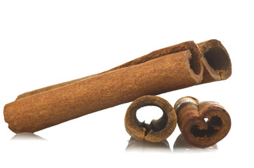 cinnamon sticks stacked on the white background