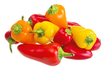 colored peppers close up  over white background