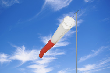 Wind direction Flag on the sky background
