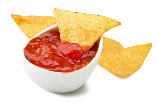 Tortilla chips and sauce tomato dip on white