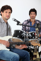 Youth with guitar and drums