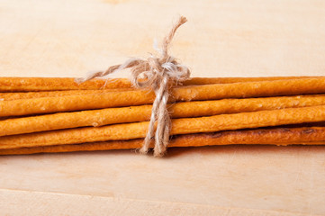 baked sticks on wooden background