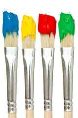 Four paintbrushes with color paints