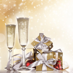 Champagne flutes with gold gifts