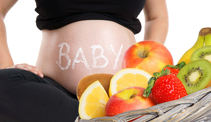 pregnant woman with fresh fruits
