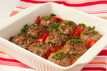 meatballs with begetables in white pan