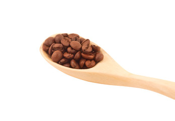 Obraz premium Wooden spoon with coffee beans