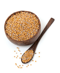 mustard in a wooden bowl and spoon