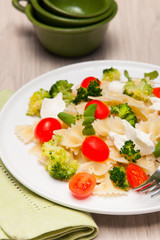Farfalle pasta with broccoli and cherry tomatoes